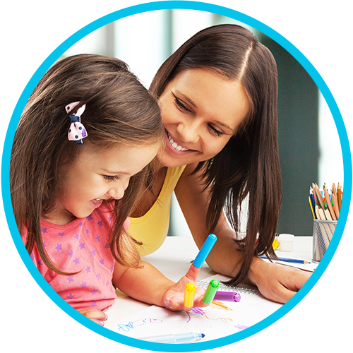 Daycare provider and child coloring and having fun together